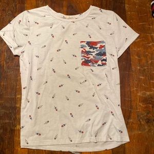 Tee shirt with little popsicle design and red white and blue camo pocket